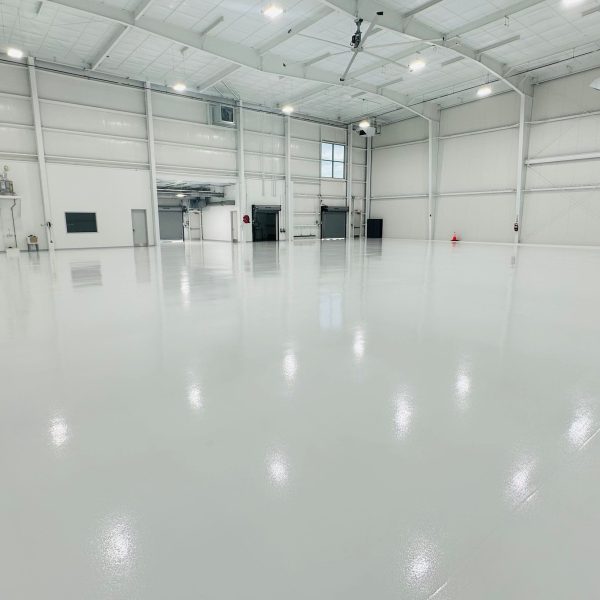 Team IA expertly prepped the hangar floor and installed an epoxy system with Rio UHG topcoat and included a glass bead anti-skid additive for  increased safety.