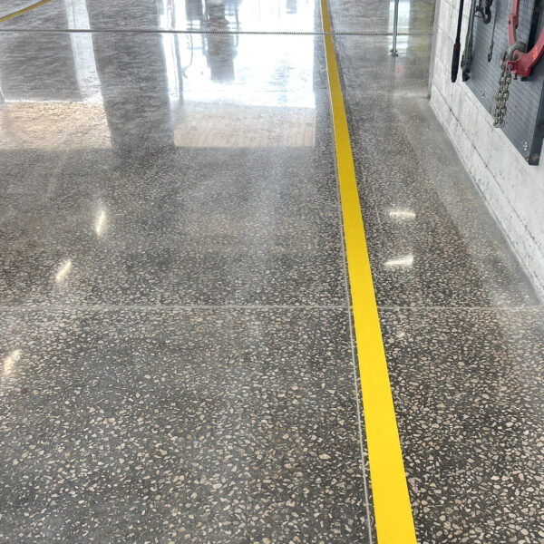 To enhance safety and efficiency, Team IA installed industrial-grade epoxy line striping over the polished concrete